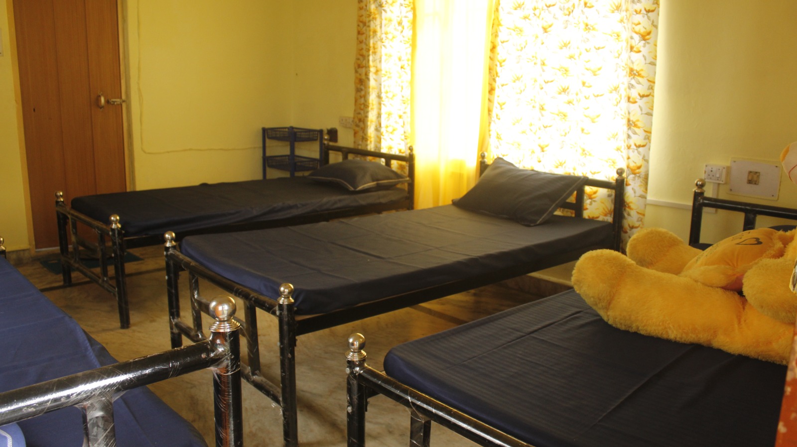 Shared room with single beds and mattresses at Sharma PG Home, Siliguri