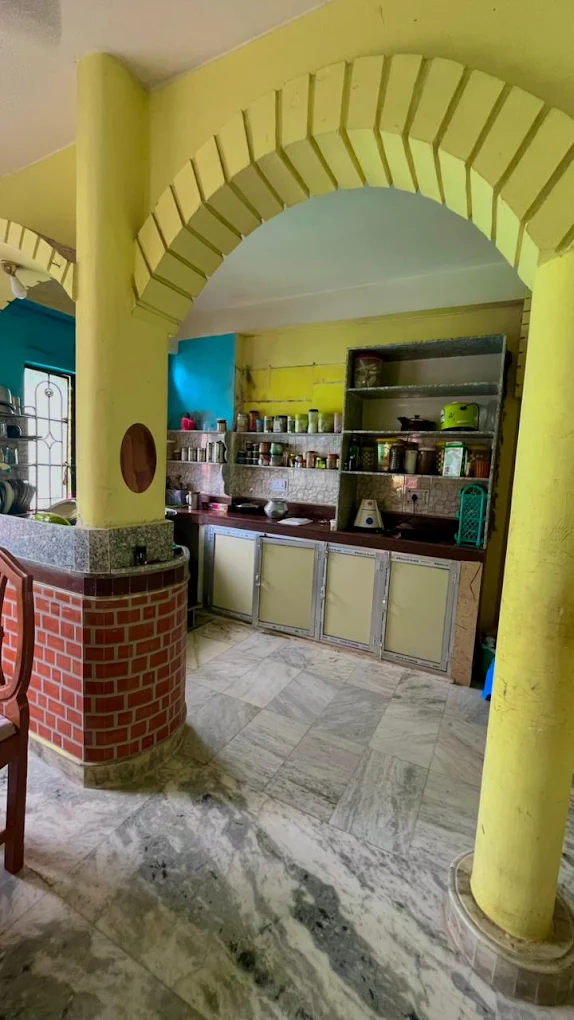 Common dining area with arched entrance at Sharma PG Home, Siliguri